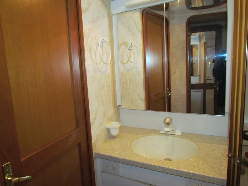 Slide: The Image of Bathroom interior of 2000 Ocean Yachts 48 Sun Sport with sink and mirror. - 2