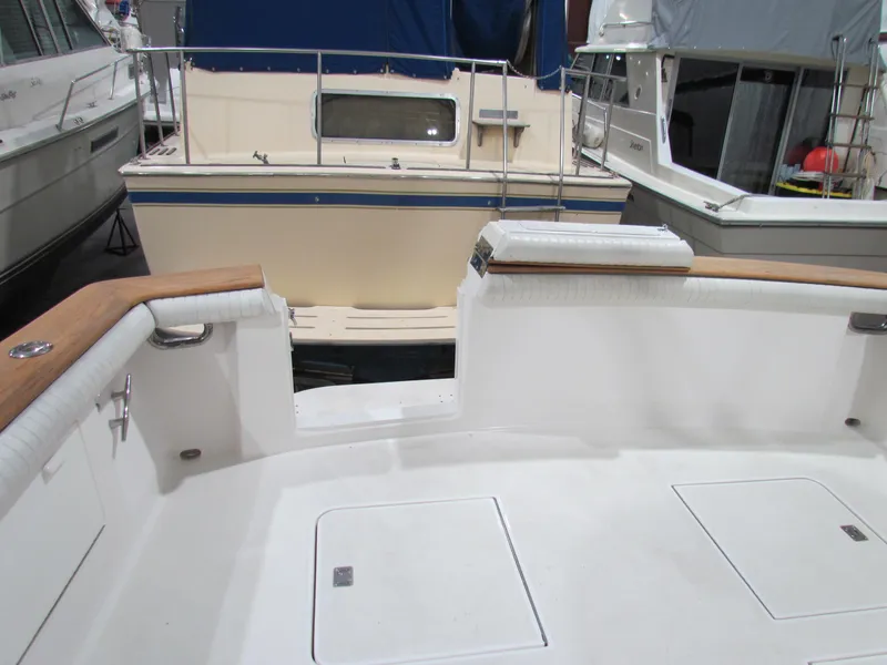 Slide: The Image of Ocean Yachts 48 Sun Sport 2000 model, spacious deck view at marina. - 25