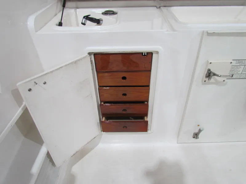 Slide: The Image of Wooden drawers on a 2000 Ocean Yachts 48 Sun Sport boat interior. - 27