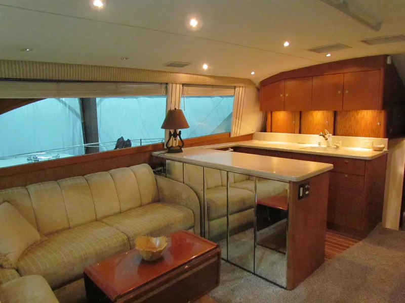 Slide: The Image of Luxurious interior of 2000 Ocean Yachts 48 Sun Sport with cozy seating and elegant cabinetry. - 3