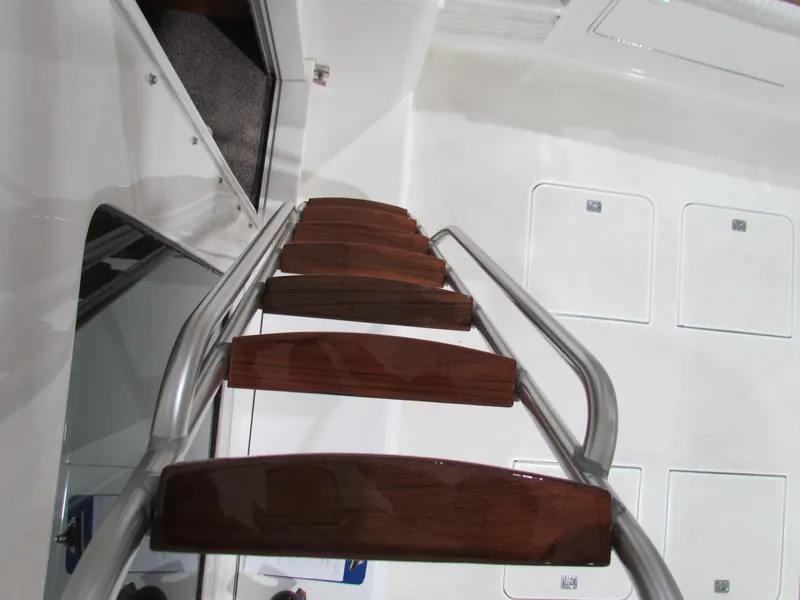 Slide: The Image of Ladder on 2000 Ocean Yachts 48 Sun Sport, featuring wooden steps and metal rails. - 33
