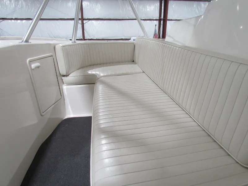 Slide: The Image of Interior seating of 2000 Ocean Yachts 48 Sun Sport, featuring white cushioned benches. - 43
