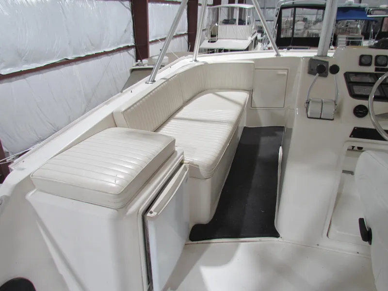 Slide: The Image of 2000 Ocean Yachts 48 Sun Sport interior with white seating and control panel. - 45