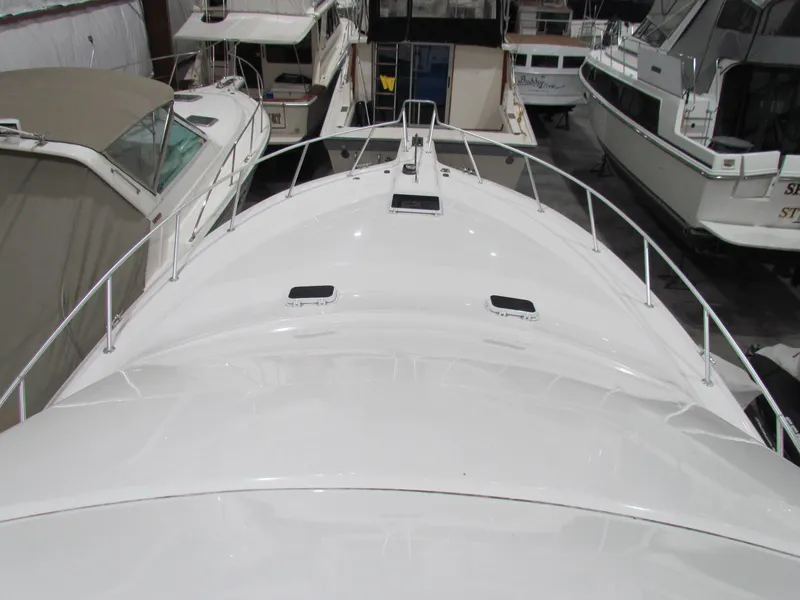 Slide: The Image of Ocean Yachts 48 Sun Sport 2000 model, white deck view in marina. - 49