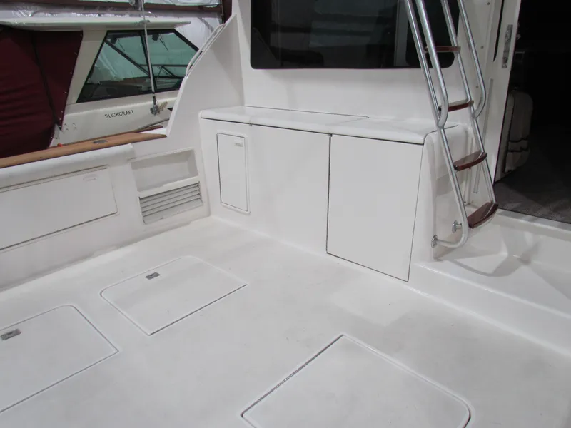 Slide: The Image of 2000 Ocean Yachts 48 Sun Sport deck with storage and ladder. - 5