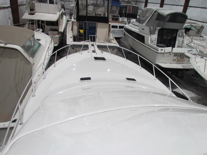 Slide: The Image of 2000 Ocean Yachts 48 Sun Sport in storage, surrounded by other boats. - 50
