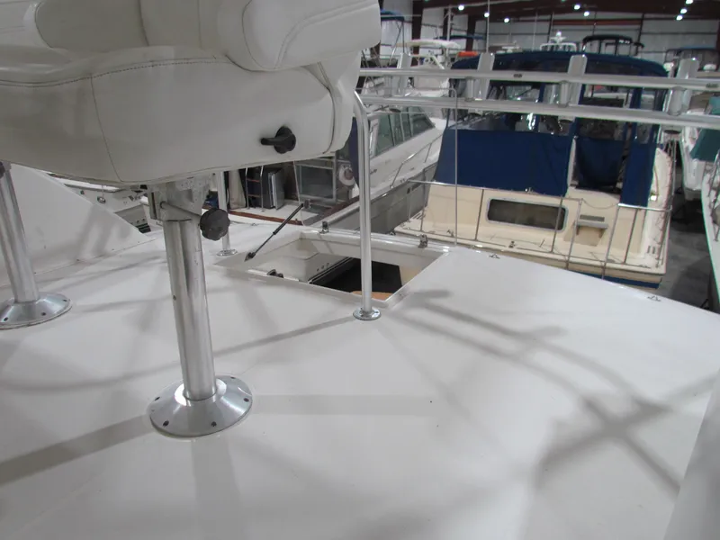 Slide: The Image of Ocean Yachts 48 Sun Sport 2000 model, deck view with seating in marina. - 51