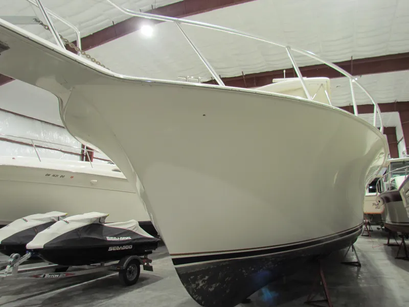 Slide: The Image of 2000 Ocean Yachts 48 Sun Sport in storage, showcasing sleek hull design. - 8