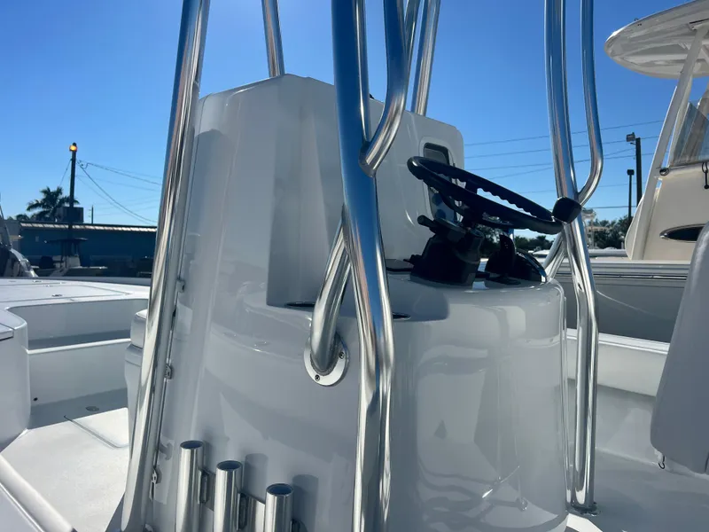 Slide: The Image of 2025 Contender 23 Bay boat console with stainless steel railings and controls. - 5