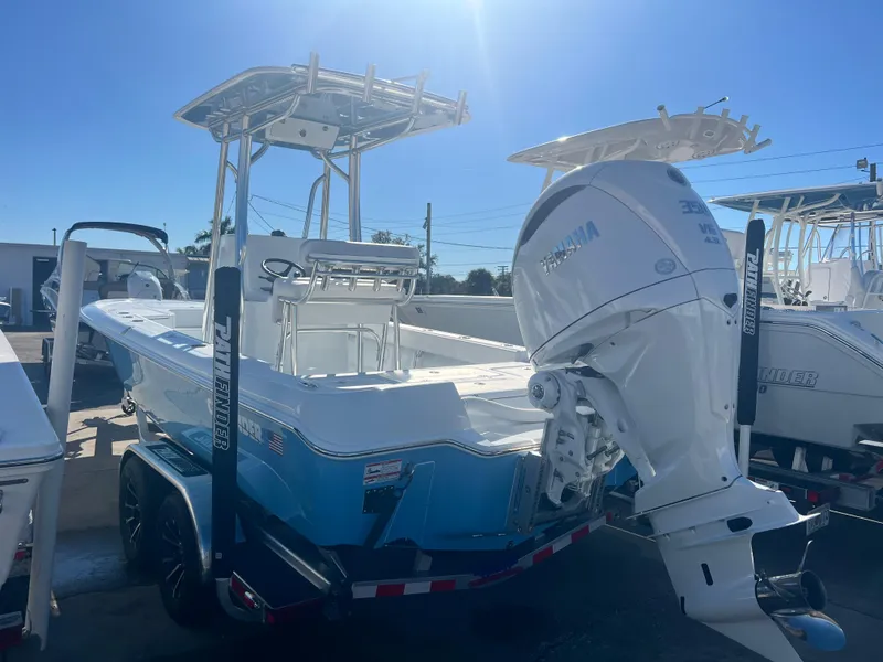 Slide: The Image of 2025 Contender 23 Bay boat with Yamaha outboard motor on trailer. - 8