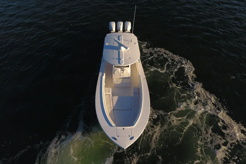 Slide: The Image of Aerial view of 2023 Regulator 34 boat cruising on open water. - 10