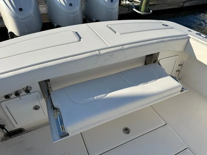 Slide: The Image of 2023 Regulator 34 boat with foldable seating and outboard motors. - 24