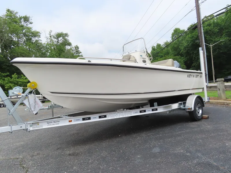 Slide: The Image of 2024 Key West 1720 Center Console boat on trailer, parked outdoors. - 0