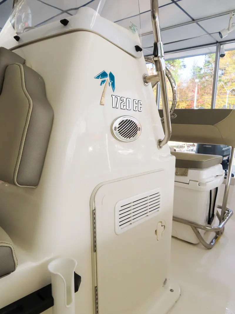 Slide: The Image of 2024 Key West 1720 Center Console boat interior, featuring seating and console details. - 10