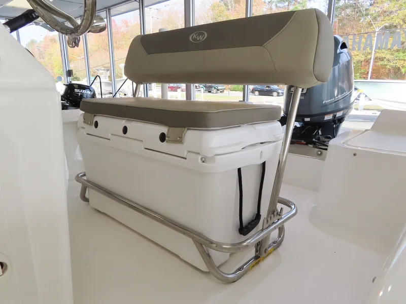 Slide: The Image of 2024 Key West 1720 Center Console boat interior with cushioned seating and storage. - 11