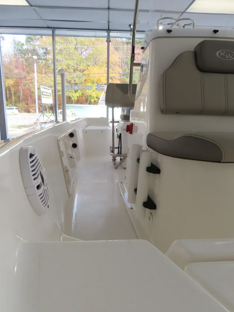 Slide: The Image of 2024 Key West 1720 Center Console boat interior with seating and controls. - 15