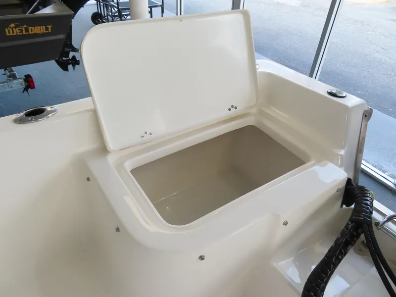 Slide: The Image of 2024 Key West 1720 Center Console boat storage compartment open. - 18