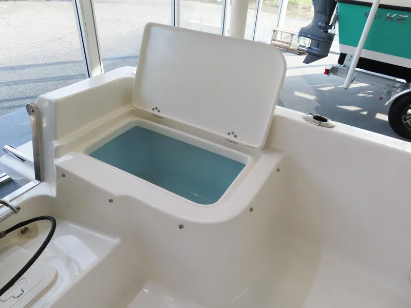 Slide: The Image of 2024 Key West 1720 Center Console boat with open storage compartment. - 20
