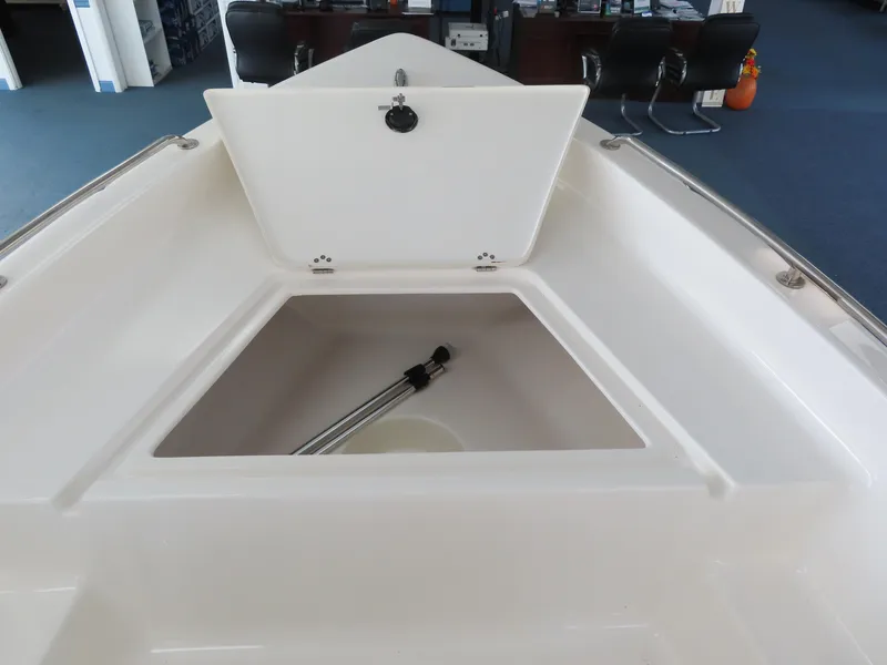 Slide: The Image of 2024 Key West 1720 Center Console boat with open storage compartment. - 22