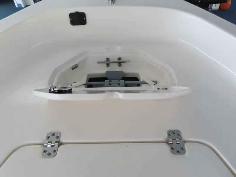 Slide: The Image of 2024 Key West 1720 Center Console boat storage compartment with open hatch. - 23