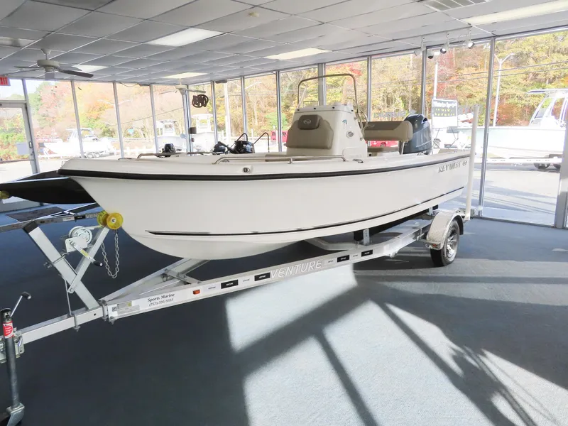 Slide: The Image of 2024 Key West 1720 Center Console boat on trailer in showroom. - 3