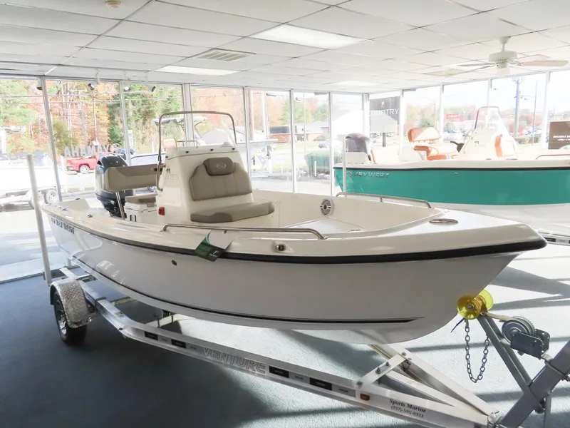 Slide: The Image of 2024 Key West 1720 Center Console boat displayed indoors on a trailer. - 4