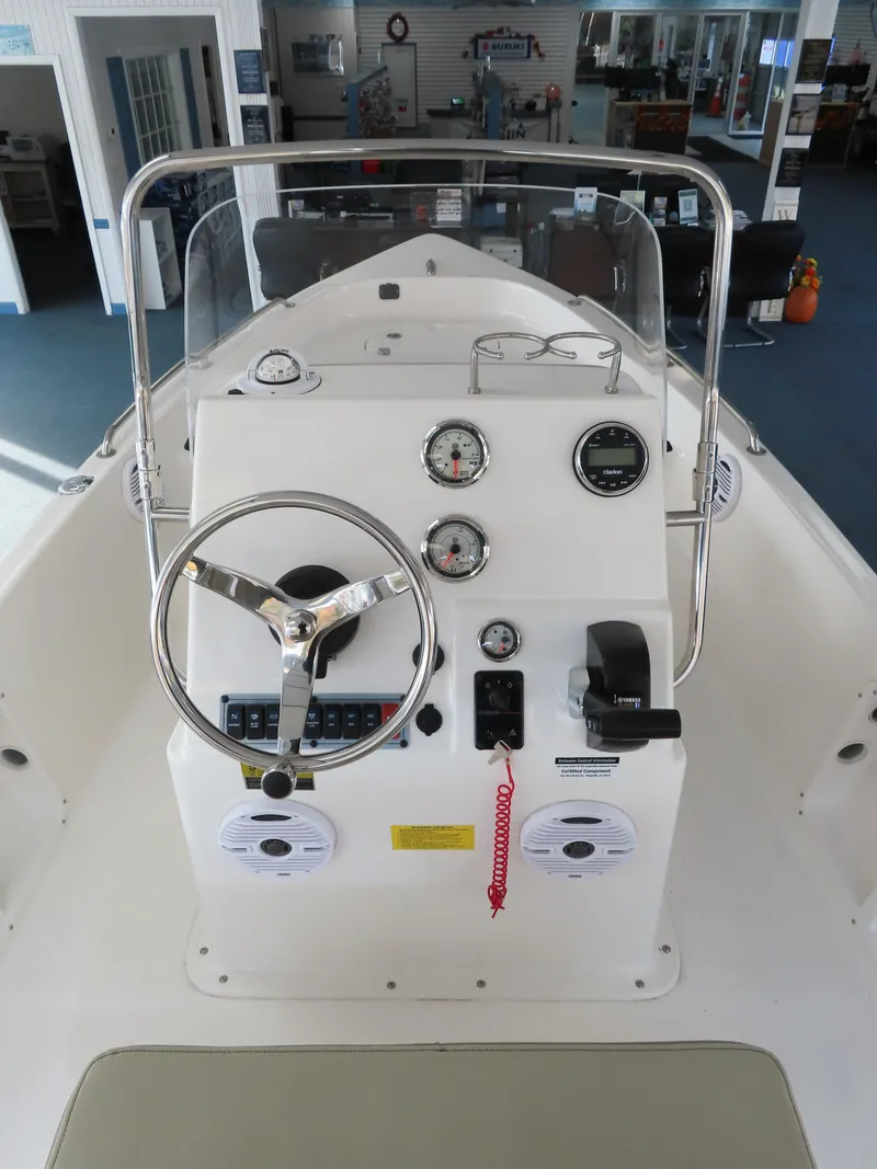 Slide: The Image of 2024 Key West 1720 Center Console boat interior with steering wheel and gauges. - 8