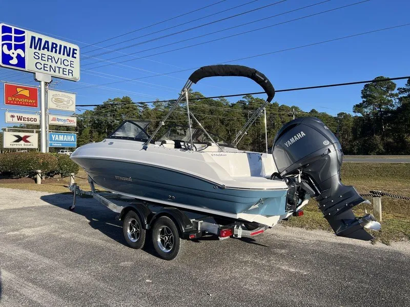 Slide: The Image of 2025 Stingray 201DC boat with Yamaha engine at Marine Service Center. - 3