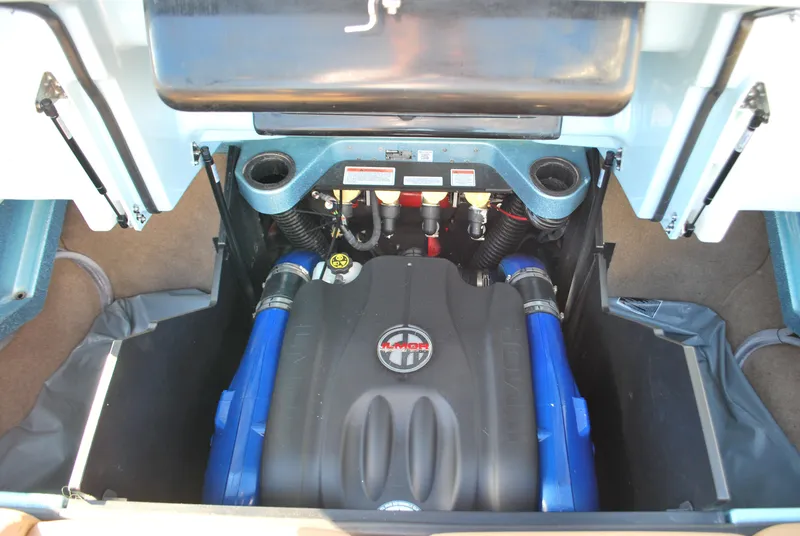 Slide: The Image of 2022 MasterCraft X24 engine compartment with blue accents and modern design. - 18