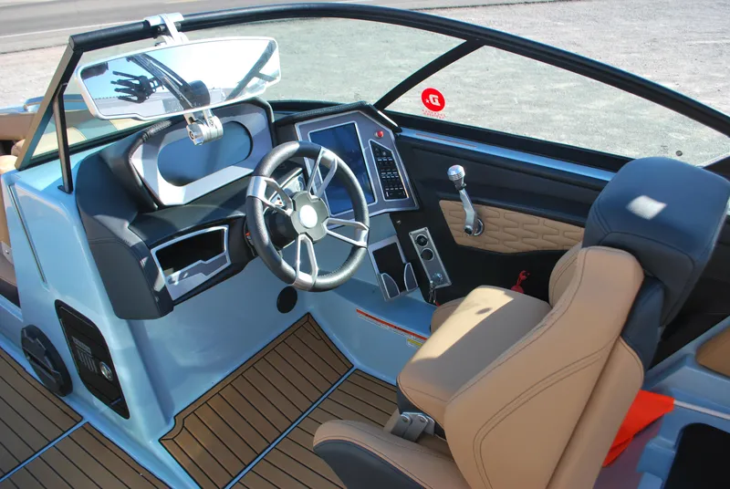 Slide: The Image of 2022 MasterCraft X24 boat interior with modern dashboard and steering wheel. - 8