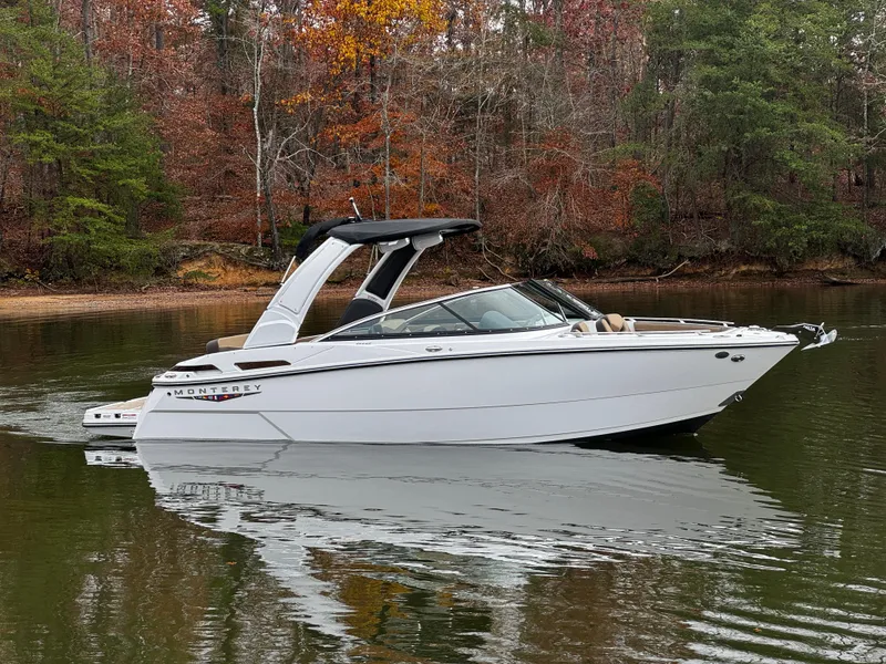 The Image of 2025 Monterey 258SS boat on calm lake with autumn trees in background. - 0