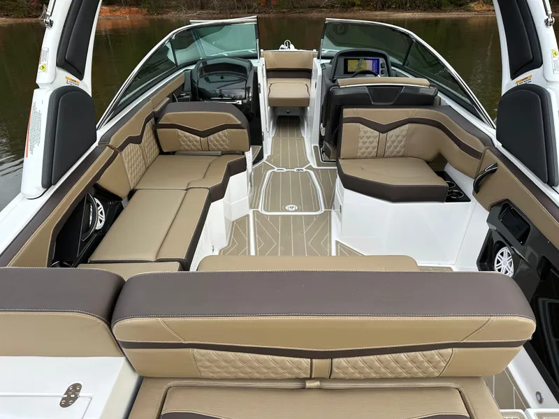 Slide: The Image of Luxurious interior of 2025 Monterey 258SS boat with beige and brown seating. - 10