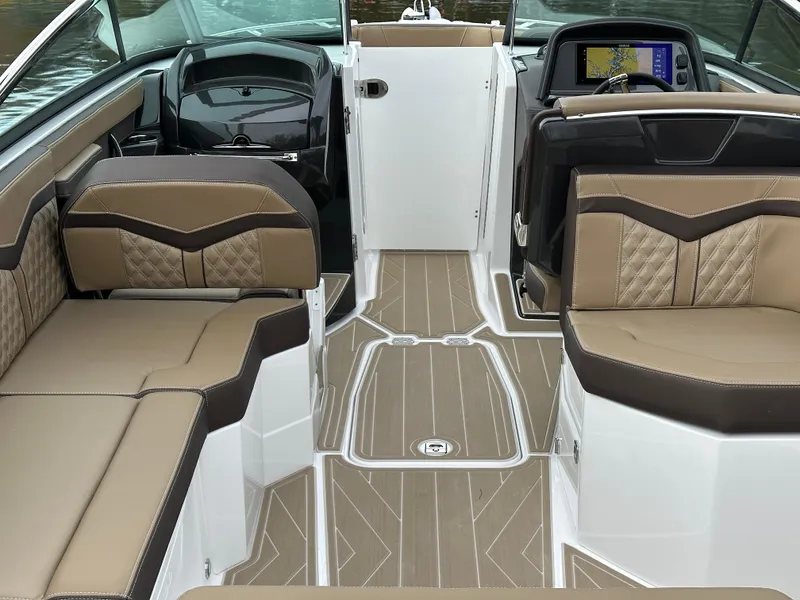 Slide: The Image of Luxurious interior of 2025 Monterey 258SS boat with tan and brown seating. - 11
