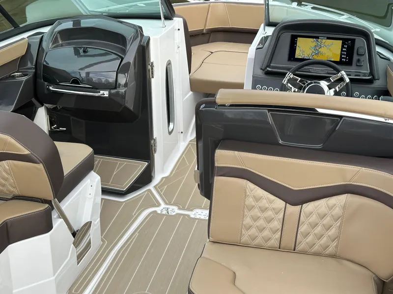 Slide: The Image of Luxurious interior of 2025 Monterey 258SS boat with modern dashboard and seating. - 13