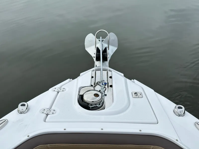 Slide: The Image of Bow of 2025 Monterey 258SS boat with anchor, on calm water. - 18