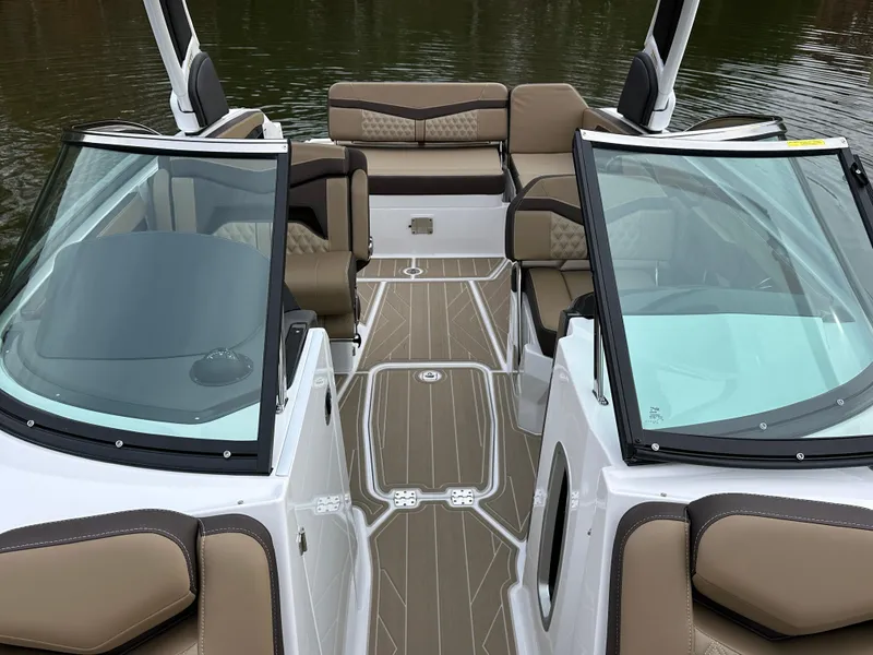 Slide: The Image of 2025 Monterey 258SS boat interior with tan seating and sleek design. - 19