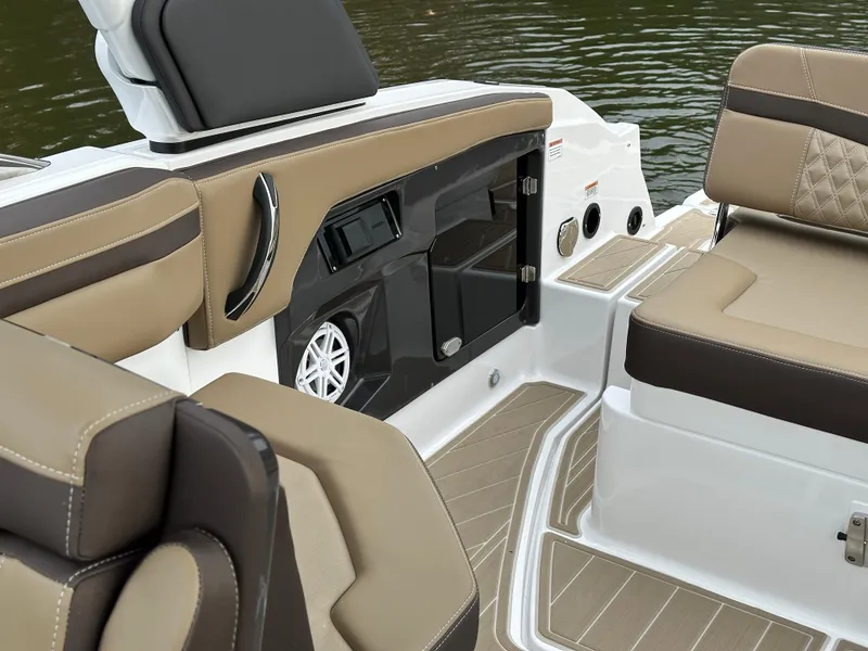 Slide: The Image of Interior of 2025 Monterey 258SS boat with tan and brown seating. - 22
