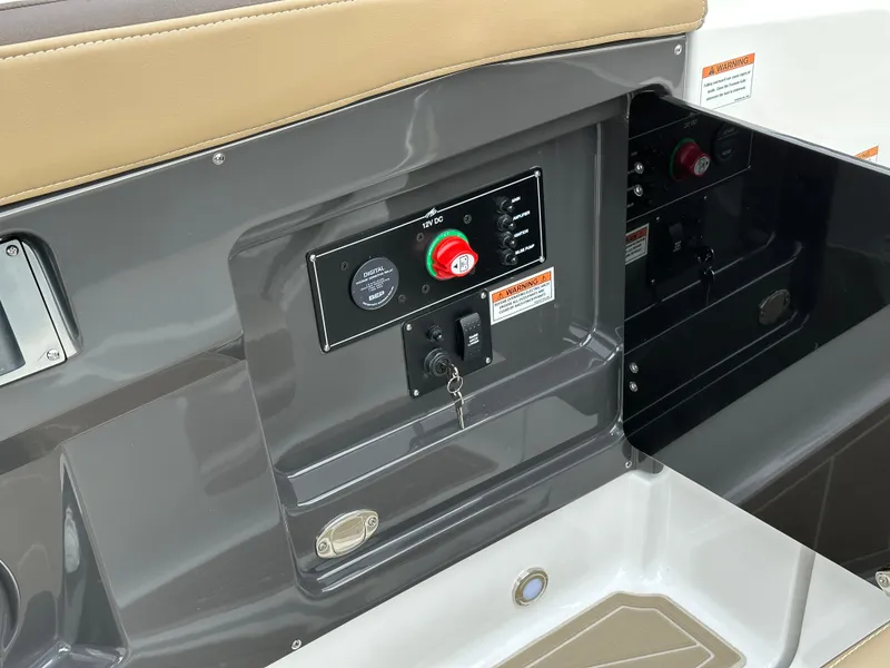 Slide: The Image of 2025 Monterey 258SS boat control panel with safety features and key ignition. - 23