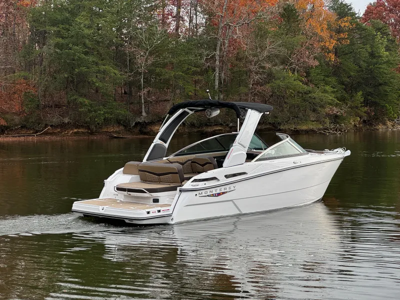 Slide: The Image of 2025 Monterey 258SS boat cruising on a serene lake with autumn foliage. - 3