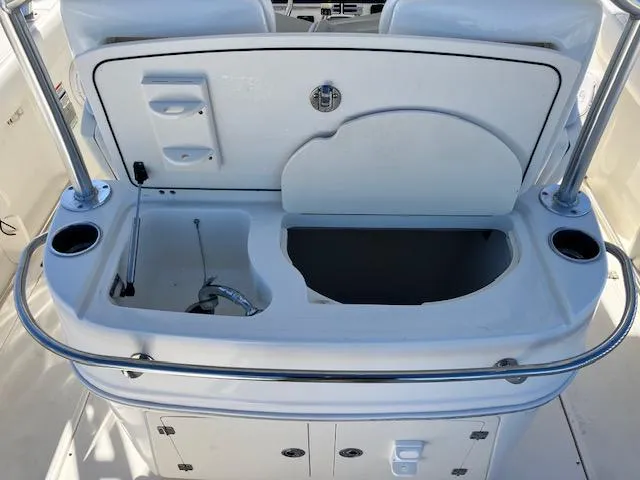 Slide: The Image of 2016 Boston Whaler 320 Outrage Cuddy Cabin sink and storage area. - 4
