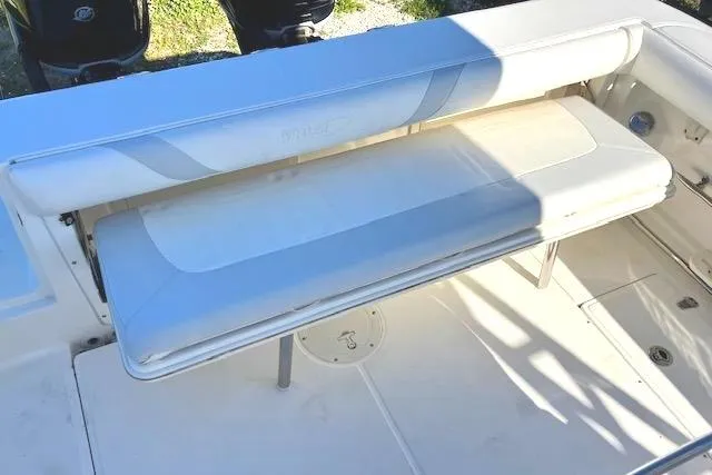 Slide: The Image of 2016 Boston Whaler 320 Outrage Cuddy Cabin boat seating area. - 9