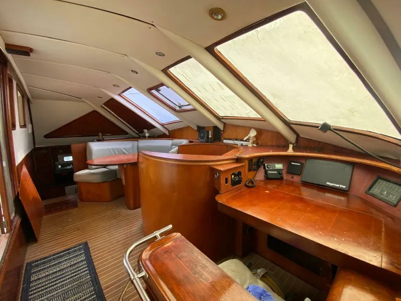 Slide: The Image of Interior of 1993 Privilege Boolean yacht with wooden furnishings and navigation equipment. - 9