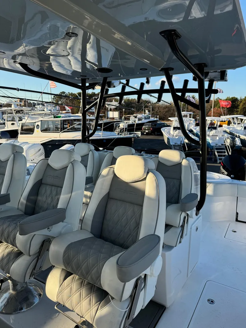 Slide: The Image of 2022 Invincible 40 Catamaran with luxurious seating and sleek design. - 14