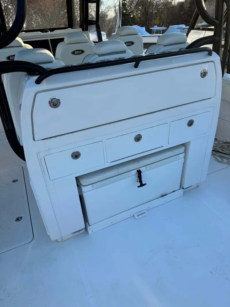 Slide: The Image of 2022 Invincible 40 Catamaran interior with storage compartments and seating. - 18