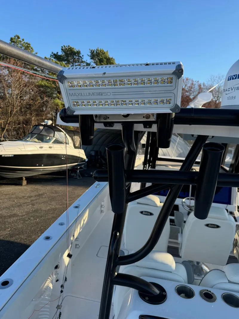 Slide: The Image of LED light on 2022 Invincible 40 Catamaran, docked with other boats in background. - 7