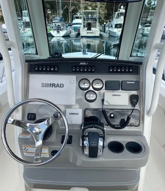 Slide: The Image of 2016 Boston Whaler 250 Outrage helm with Simrad electronics and controls. - 3
