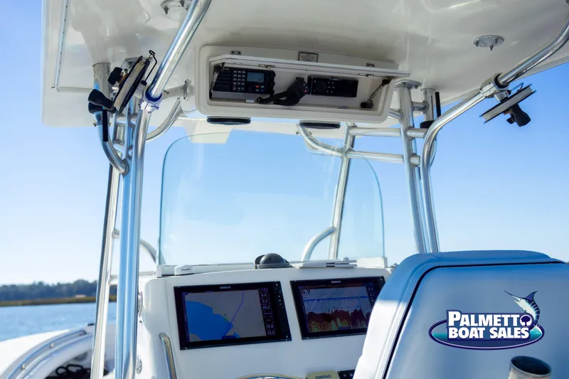 Slide: The Image of 2011 Regulator 28 boat dashboard with navigation screens and controls. - 23