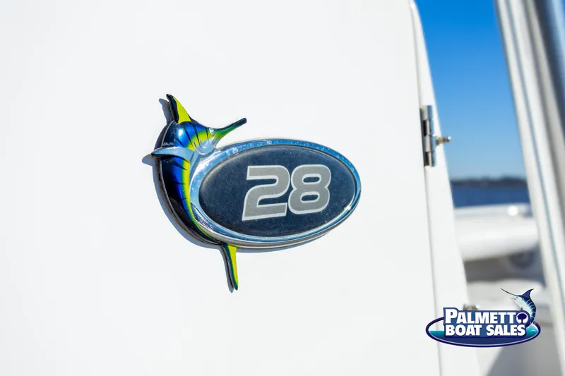Slide: The Image of Regulator 28 boat emblem, 2011 model, with Palmetto Boat Sales logo. - 32