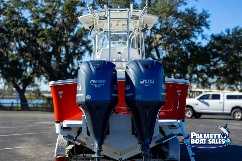 Slide: The Image of 2011 Regulator 28 boat with twin Yamaha 300 engines, displayed at Palmetto Boat Sales. - 4