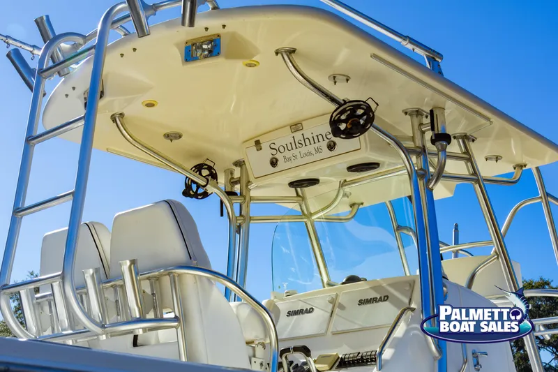 Slide: The Image of 2011 Regulator 28 boat with T-top and Simrad electronics, sold by Palmetto Boat Sales. - 6